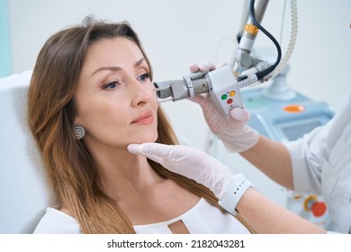 Procedure for laser removal of neoplasms on the face in a cosmetology clinic - Shutterstock ID 2182043281