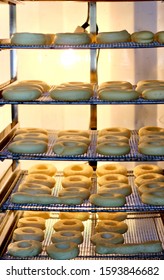 Procedure Of Making Donuts In A Small Town Donut Bakery - Donuts Preparing To Fry In A Deep Fryer. Scene. Process Of Preparation Of Donuts