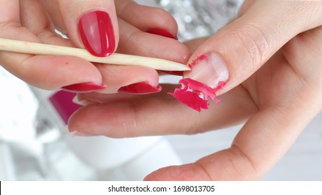 The Procedure For Removing Gel Polish From Nails In Progress. Gel Nail Polish Remover Foils On Woman's Hands.