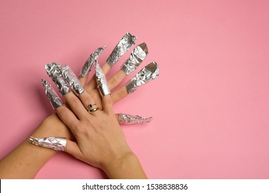 The Procedure For Removing Varnish From Nails Hybrid Nails In Progress. Gel Nail Polish Remover Foils On Woman's Hands