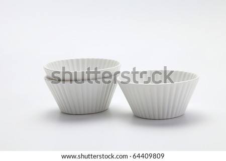 procelain muffin mold on the plain background