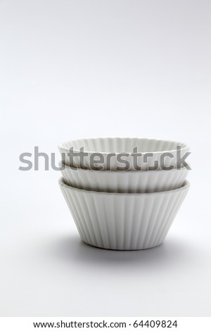 procelain muffin mold on the plain background