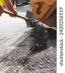 Process of asphalting, blacktopping and paving, asphalt paver machine and steam roller compactor during construction and repairing works, workers on the construction site, rental vehicle working

