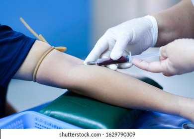 The Process Of A Blood Test For A Woman's Health Check In The Hospital To Check Blood Sugar Or Glucose And Cholesterol Levels In The Annual Health Examination Program. And Covit-19 Virus Screening.