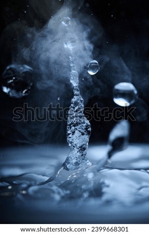 The process of boiling water, a stream of water shooting out of a humidifier or diffuser taken in close-up.