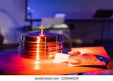 The Process Of Breaking Bread In The Modern Church. Breaking Bread Ceremony In Protestant Church. Religious Tradition Of Breaking Bread. Bread And Wine.