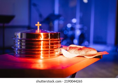 The Process Of Breaking Bread In The Modern Church. Breaking Bread Ceremony In Protestant Church. Religious Tradition Of Breaking Bread. Bread And Wine.