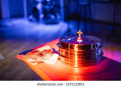 The Process Of Breaking Bread In The Modern Church. Breaking Bread Ceremony In Protestant Church. Religious Tradition Of Breaking Bread. Bread And Wine.