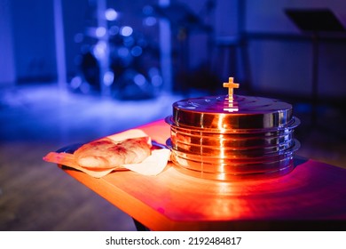 The Process Of Breaking Bread In The Modern Church. Breaking Bread Ceremony In Protestant Church. Religious Tradition Of Breaking Bread. Bread And Wine.