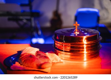 The Process Of Breaking Bread In The Modern Church. Breaking Bread Ceremony In Protestant Church. Religious Tradition Of Breaking Bread. Bread And Wine.