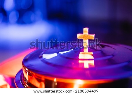 The process of breaking bread in the modern church. Breaking bread ceremony in protestant church. Religious tradition of breaking bread. Bread and wine.