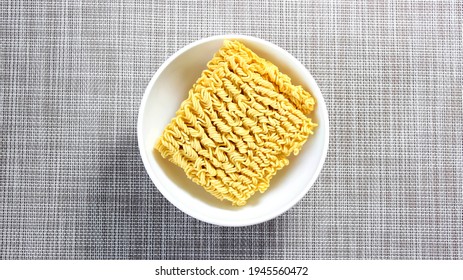 The Process Of Brewing Instant Noodles With Spices With Boiling Water. Top View.