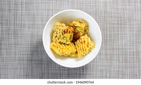 The Process Of Brewing Instant Noodles With Spices With Boiling Water. Top View.