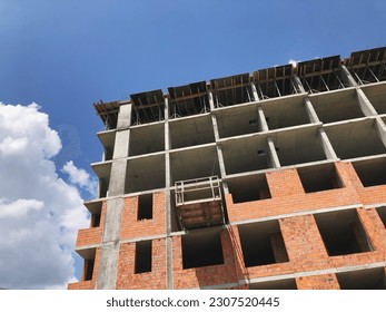 The process of building an apartment area. Construction site, residential apartment building, the concept of buying your own home, mortgage lending. Residental area buiding process