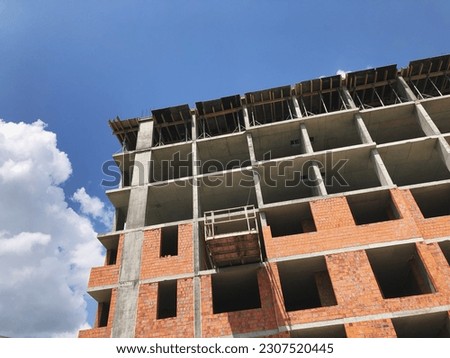 The process of building an apartment area. Construction site, residential apartment building, the concept of buying your own home, mortgage lending. Residental area buiding process