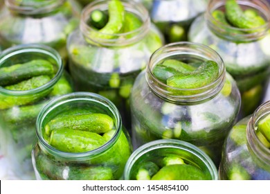 The Process Of Canning Pickled Gherkins For The Winter, Pickles Cucumbers In Glass Jars Close Up