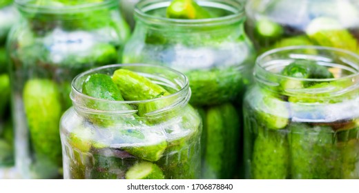 The Process Of Canning Pickled Gherkins For The Winter, Pickles Cucumbers In Glass Jars Close-up.