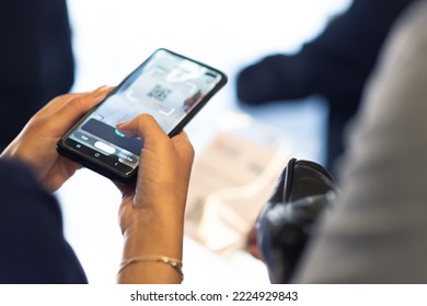 Process of checking in on a conference congress forum event. Scaning a QR codes from attendee upon arrival to check in - Powered by Shutterstock