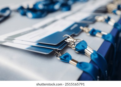 Process of checking in on conference congress forum event, registration desk table, visitors and attendees receiving lanyard with name badge and entry wristband bracelet and register electronic ticket - Powered by Shutterstock