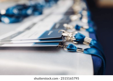 Process of checking in on conference congress forum event, registration desk table, visitors and attendees receiving lanyard with name badge and entry wristband bracelet and register electronic ticket - Powered by Shutterstock