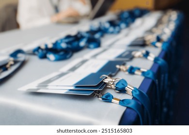 Process of checking in on conference congress forum event, registration desk table, visitors and attendees receiving lanyard with name badge and entry wristband bracelet and register electronic ticket - Powered by Shutterstock