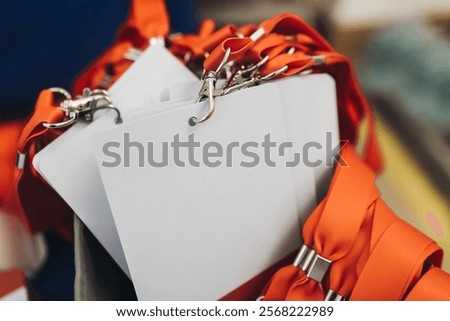 Process of checking in on conference congress forum event, registration desk table, visitors and attendees receiving lanyard with name badge and entry wristband bracelet and register electronic ticket