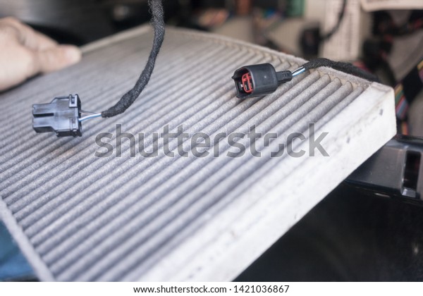 The process of cleaning car air
conditioning. Dirty air conditioner filter of car.

