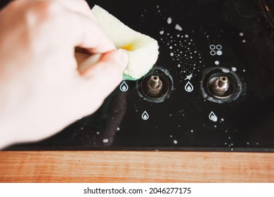 Process Of Cleaning Glass Surface Of Stove Oven. Cooker Knob Removed From Gas Cooker.