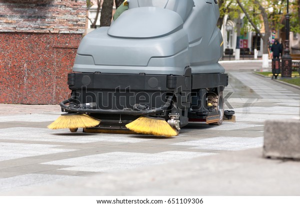 process of\
cleaning walkways in the Park\
machine