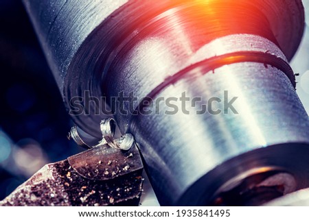 Process CNC lathe machine cutting metal. Modern industrial iron automotive technology.