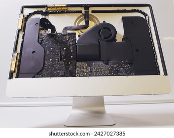 Process of computer repair. Engineer in white gloves disassembling computer