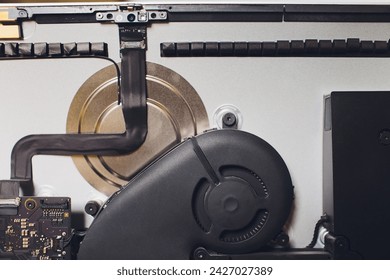 Process of computer repair. Engineer in white gloves disassembling computer
