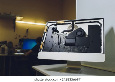 Process of computer repair. Engineer in white gloves disassembling computer