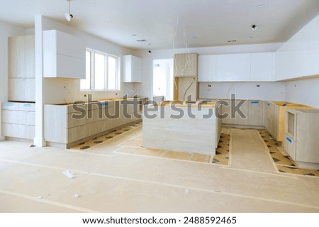 In process of constructing home improvement project, new custom kitchen cabinet is being assembled