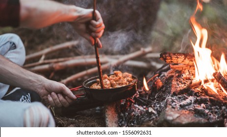 Process Of Coocking On The Fire In A Forest. 