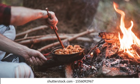 Process Of Coocking On The Fire In A Forest. 