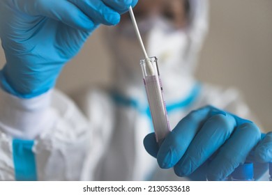 Process Of Coronavirus PCR Antigen Testing Examination By Nurse Medic In Laboratory Lab, COVID-19 Swab Collection Kit, Test Tube For Taking OP NP Patient Specimen Sample, Patient Receiving A Test