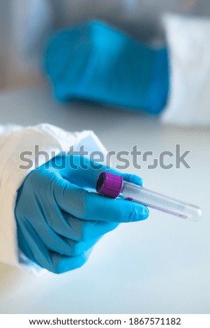 Process of coronavirus testing examination by nurse medic in laboratory lab, COVID-19 swab collection kit, test tube for taking OP NP patient specimen sample, patient receiving a corona test
