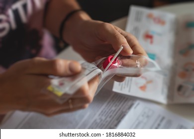 Process Of Coronavirus Testing Examination At Home, COVID-19 Swab Collection Kit, Test Tube For Taking OP NP Patient Specimen Sample, Testing Carried Out, Patient Receiving A Corona Test