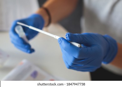 Process of coronavirus testing examination at home, COVID-19 swab collection kit, test tube for taking OP NP patient specimen sample, testing carried out, patient receiving corona test 