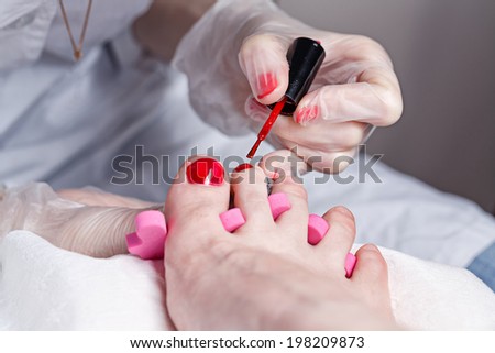 The process of creating a pedicure in the spa salon shot closeup