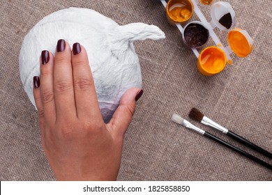 The Process Of Creating Pumpkins Out Of Paper Mache For Halloween, A Holiday In Isolation.