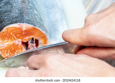 The Process Of Cutting With A Knife Trout, Salmon Fish Head