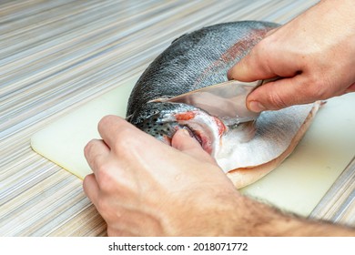 The Process Of Cutting With A Knife Trout, Salmon Fish Head