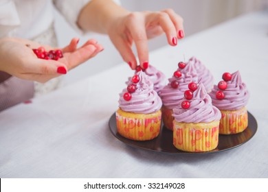 The Process Of Decorating Cupcakes