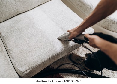 Process Of Deep Furniture Cleaning, Removing Dirt From Sofa. Washing Concept.