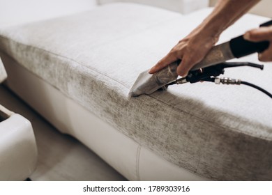 Process Of Deep Furniture Cleaning, Removing Dirt From Sofa. Washing Concept.