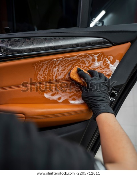 the\
process of dry cleaning in a sports car interior\

