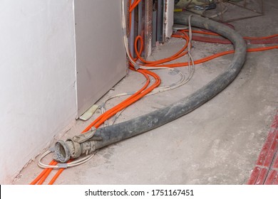 The process of filling floors in a new house. Concrete floors in a new building. Equipment for filling the floor. Concrete filling process. - Shutterstock ID 1751167451