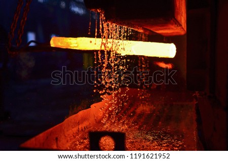 The process of forging metal in the production of heavy molded metal products. Blacksmithing. Pattern and forms for the artist blacksmith. Treatment of molten metal close-up. Handmade blacksmith